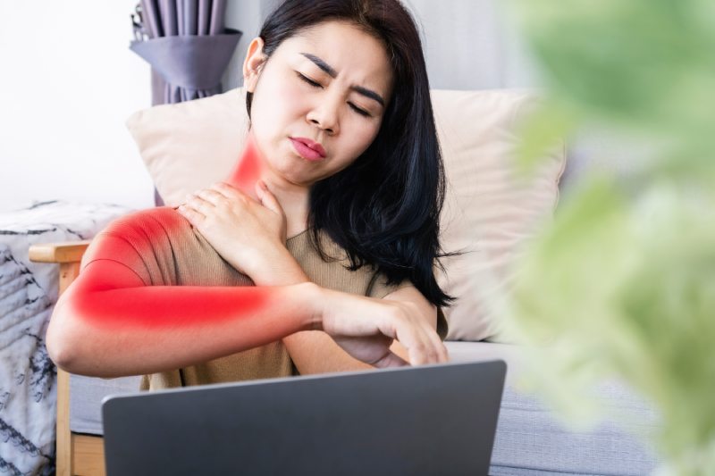 A woman experiences neck and arm pain