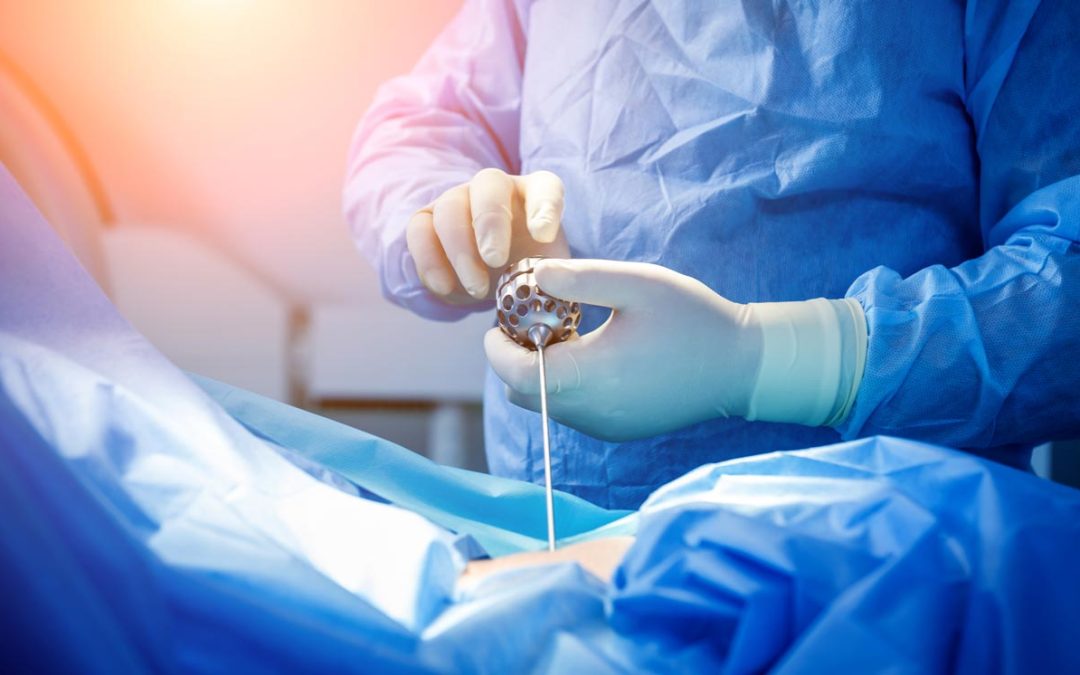 Orthopaedic surgeon performs endoscopic spine surgery on patient